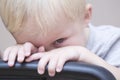 Shy Baby Boy Peeking Over Chair Royalty Free Stock Photo