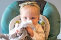 Shy Baby Girl Happy in High Chair Royalty Free Stock Photo