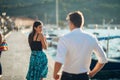 Shy flirty woman smiling to a man.Man giving a compliment to a introvert passing woman.Receiving a compliment on the street.Public Royalty Free Stock Photo
