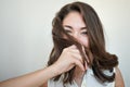 Shy girl hiding her face with hair Royalty Free Stock Photo