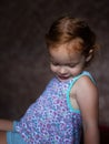 Shy little ginger girl embarrassed portrait Royalty Free Stock Photo