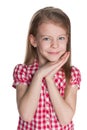 Shy little girl against the white Royalty Free Stock Photo