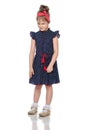 Shy little girl in the blue dress. Royalty Free Stock Photo