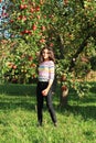 Girl standing under apple tree Royalty Free Stock Photo