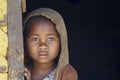 Shy and poor african girl with headkerchief