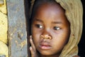Shy and poor african girl with headkerchief
