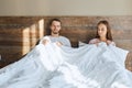 Young pretty couple lying in bed Royalty Free Stock Photo