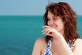 Shy Smiling Woman on a Beach Royalty Free Stock Photo