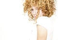 Shy young woman with curly hair Royalty Free Stock Photo