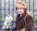 Shymkent, KAZAKHSTAN - 22 March 2017: People Celebrating the Kazakh holiday NARIYZ. Boy with a hawk