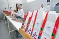 Shymkent, Kazakhstan - 03.12.2020 : Rakhat confectionery factory. Employees pack candy in branded boxes Royalty Free Stock Photo