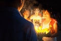 theravada buddhist pilgrim girls with a candle and flower float raft during a religious holy celebration