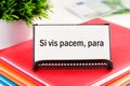 Si vis pacem, para bellum. Latin phrase meaning If you want peace, prepare for the war. on white business cards in delivery on a