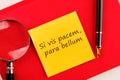 Si vis pacem, para bellum. Latin phrase meaning If you want peace, prepare for the war. on a yellow sticker on a red notebook