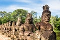 Image in Angkor Wat complex temple. Decorated bridge with warrios guardian and naga serpent. Royalty Free Stock Photo