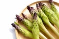 Siam tulip (Cucuma Sparganifolia), young Krachiew stem flowers on wood plate.