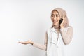 sian woman making a call using a cell phone and presenting copy space Royalty Free Stock Photo
