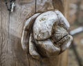 SIAULIAI, LITHUANIA - JULY 28, 2019: Old wooden sculptures on religious themes at the Hill of Crosses