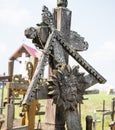 SIAULIAI, LITHUANIA - JULY 28, 2019: Old wooden sculptures on religious themes at the Hill of Crosses