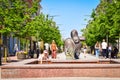 Siauliai main boulevard street with fountain. Lithuanian people enjoy summer day in Siauliai city center in hot day refreshing