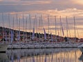 Sibenic, Croatia - may 8, 2015: Sailingyachts of Buweiser regatta moored on a pier near old seaside town in the rays of the evenin Royalty Free Stock Photo