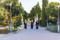 SIBENIK, CROATIA, SEPTEMBER 29, 2017: three unknown persons with traditional clothes walking in the park and leading fir the saint