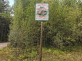 Siberia. Forest. A sign in the woods. Sign. Grass. Bushes. Leaves Royalty Free Stock Photo