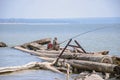 Siberia, Ob river, Russia, 07.24.2020. A fisherman sits on the shore with a fishing rod