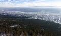 Siberian city between the taiga hills in the floodplain of the Lena river