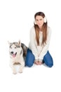 siberian husky dog and attractive woman in winter earmuffs Royalty Free Stock Photo