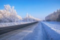 Siberian rural empty asphalt road under the snow Royalty Free Stock Photo