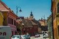 SIBIU, ROMANIA: The so-called home with eyes, rooflights on roof. Traditional multicolored houses on the street with unusual