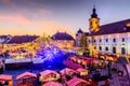 Sibiu, Romania. Christmas Market in Piata Mare at twilight.