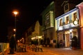 Pardon Cafe on Cetatii Street strada Cetatii in Sibiu, at night, with empty tables and chairs