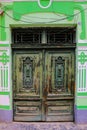 Sibiu, Romania, May 15, 2019: Traditional, colorful, decaying wooden courtyard doors of old townhouses in the center Royalty Free Stock Photo