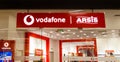 Sibiu, Romania - May, 2 2022: Vodafone and Arsis logo signboard at store front in Promenada Mall, one of the biggest