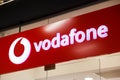 Sibiu, Romania - May, 2 2022: Vodafone logo signboard at store front in Promenada Mall, one of the biggest shopping