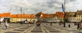 Sibiu, Romania - 2019. Tourist wondering in the panoramic The Big Square Piata Mare of Sibiu looking and the City hall Royalty Free Stock Photo