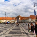 Sibiu, Romania - 2019. Tourist wondering in the panoramic The Big Square Piata Mare of Sibiu looking and the City hall Royalty Free Stock Photo