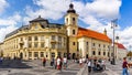 Sibiu, Romania - 2019. Tourist wondering in the panoramic The Big Square Piata Mare of Sibiu looking and the City hall Royalty Free Stock Photo