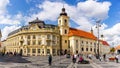Sibiu, Romania - 2019. Tourist wondering in the panoramic The Big Square Piata Mare of Sibiu looking and the City hall Royalty Free Stock Photo