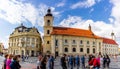 Sibiu, Romania - 2019. Tourist wondering in the panoramic The Big Square Piata Mare of Sibiu looking and the City hall Royalty Free Stock Photo