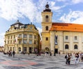 Sibiu, Romania - 2019. Tourist wondering in the panoramic The Big Square Piata Mare of Sibiu looking and the City hall Royalty Free Stock Photo