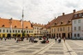 Sibiu, Romania - 2019. Tourist wondering in the panoramic The Big Square Piata Mare of Sibiu looking and the City hall Royalty Free Stock Photo