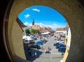 Sibiu, Transylvania, Romania. Daily life in the Small Square (Piata Mica) with the old Catholic Cathedral and the Liars Bridge vi Royalty Free Stock Photo
