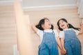 Sibling Asian girls having fun on the stairs