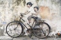 Sibling Cyclist Street Art Mural in Georgetown, Penang, Malaysia Royalty Free Stock Photo