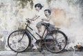 Sibling Cyclist Street Art Mural in Georgetown, Penang, Malaysia Royalty Free Stock Photo