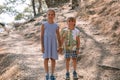 Sibling kids travelers a boy brother of five years old and a girl sister of eight years old holding hands in mountains of turkey a