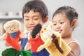 Sibling playing hand puppet Royalty Free Stock Photo